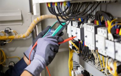 galing Electrician engineer tests electrical installations and wires on relay protection system. Adjustment of scheme of automation and control of electrical equipment.